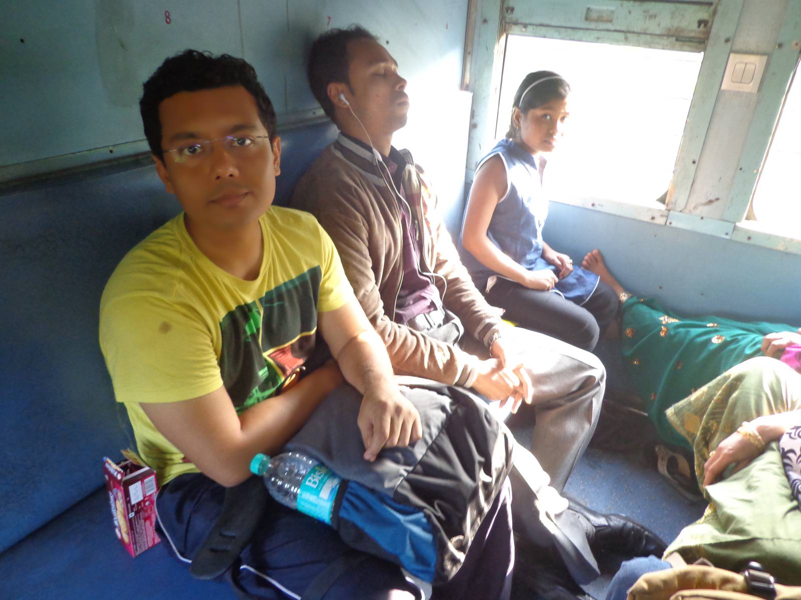 Nandy with fellow passengers. The small girl was reading an Assamese to English wordlist.