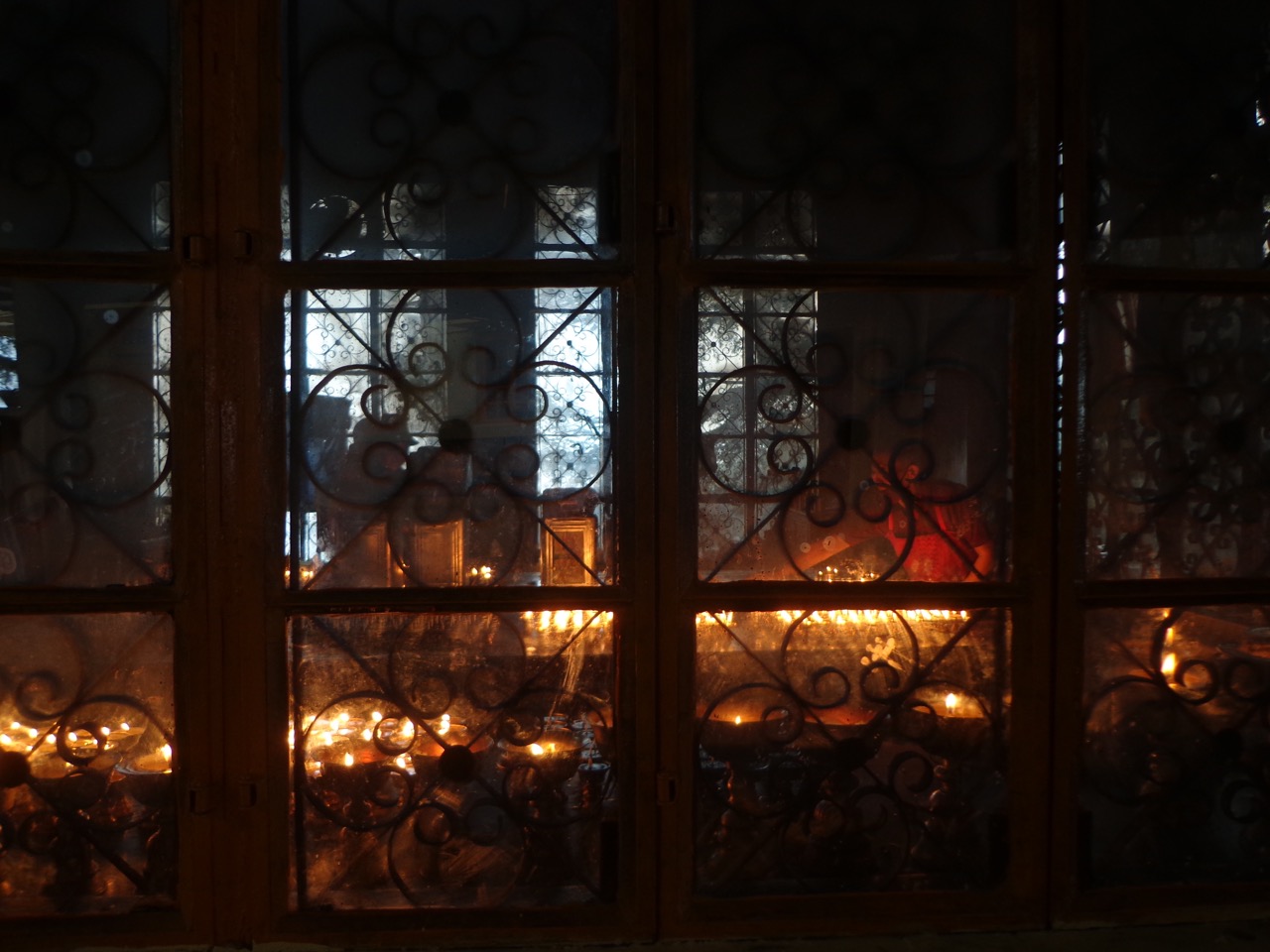 Monks lighting up butter lamps for offering.