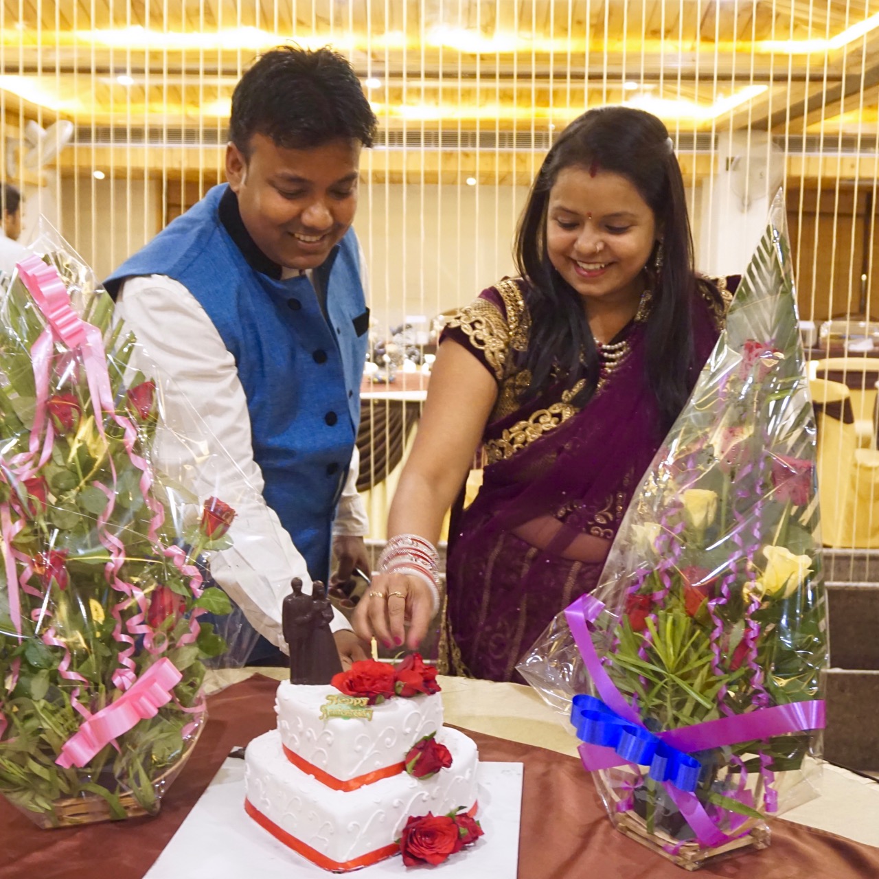Nandan and his wife dissecting their anniversary cake.