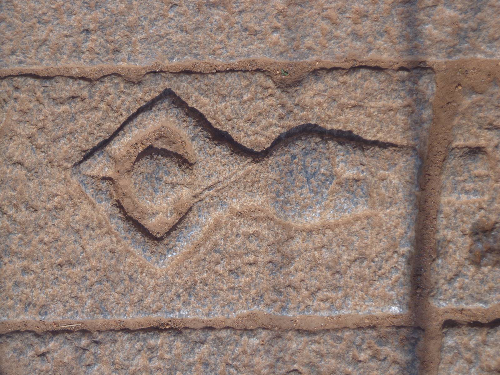 An engraving of a symbolic devotee prostrating infront of Vishnu.