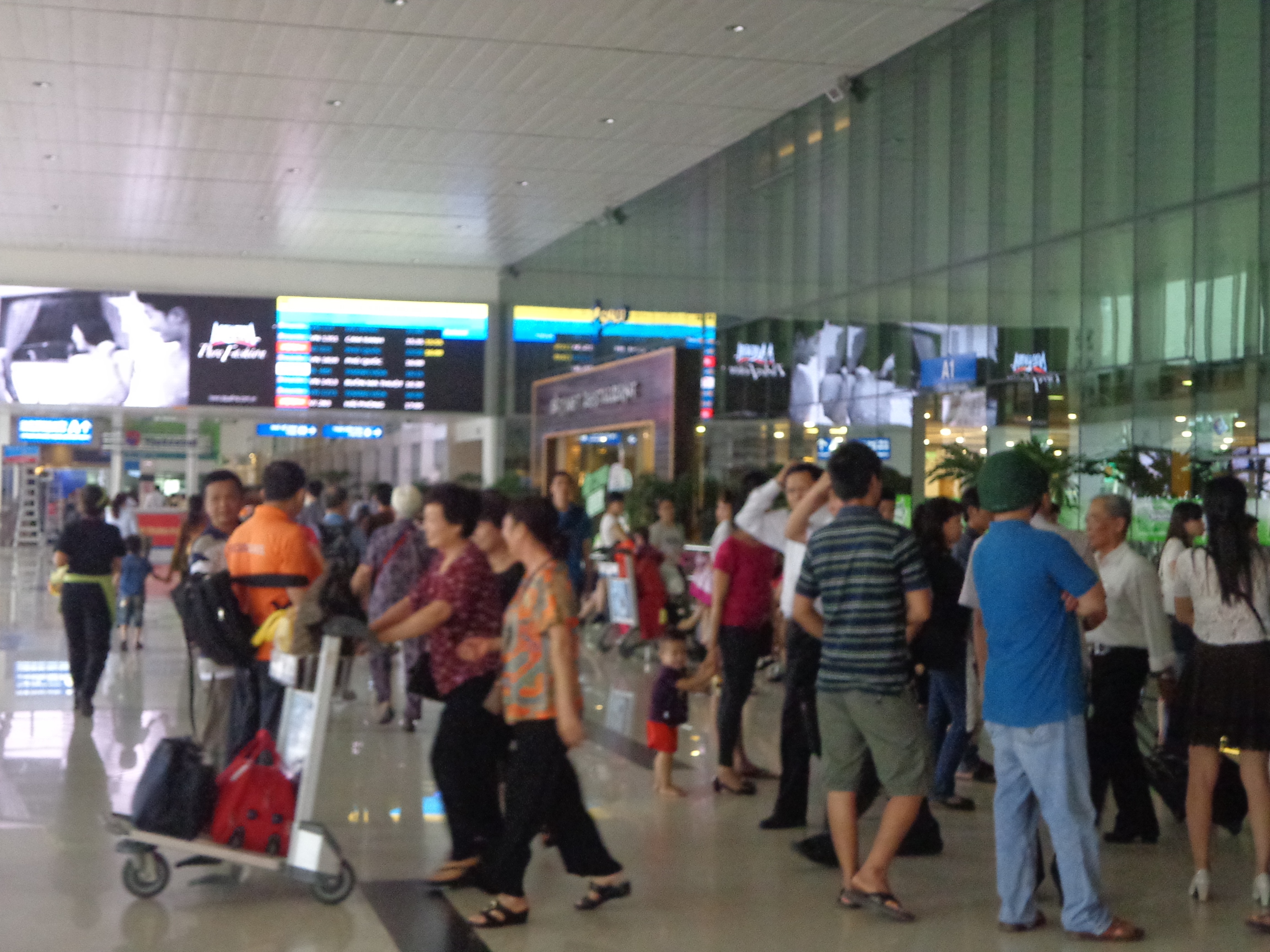 People outside the domestic terminal of HCMC airport.