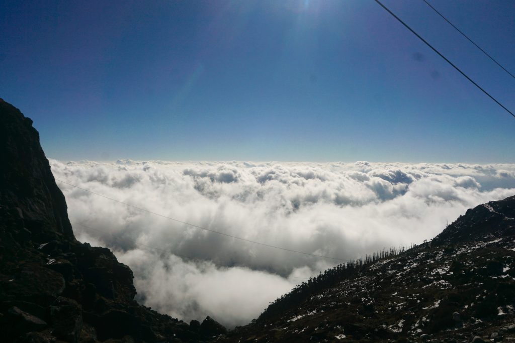 Clouds obscured the view of the valley below.