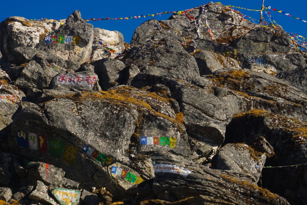 &ldquo;Om mani padme hum&rdquo; painted on the rocks at Sela Pass.