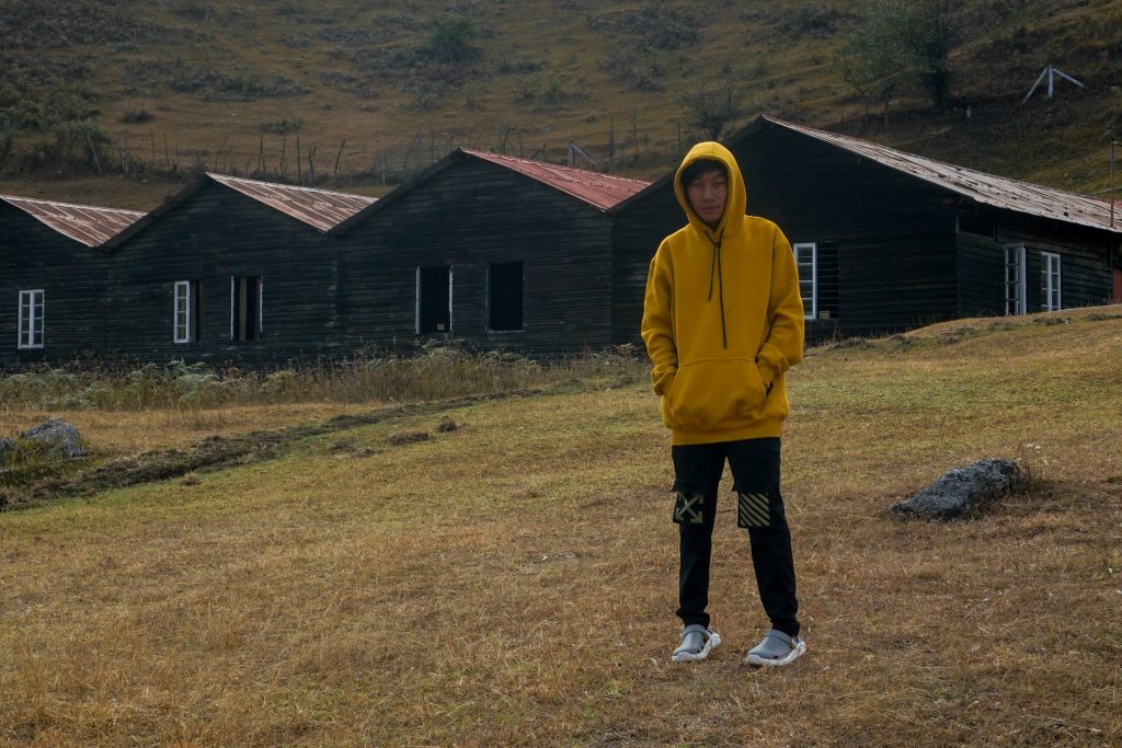 Dawa posing on an empty farmland.