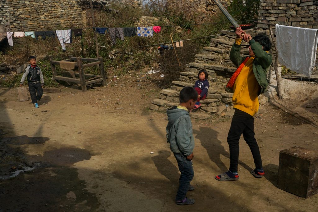 Kids playing cricket with Dawa.