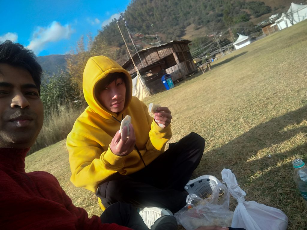 Dawa posing with the momos we got from Rama Camp.