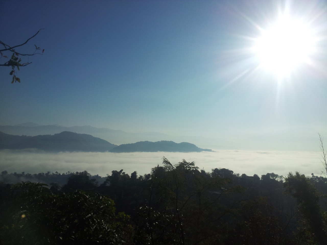 The villages and settlements are hidden beneath a layer of clouds.