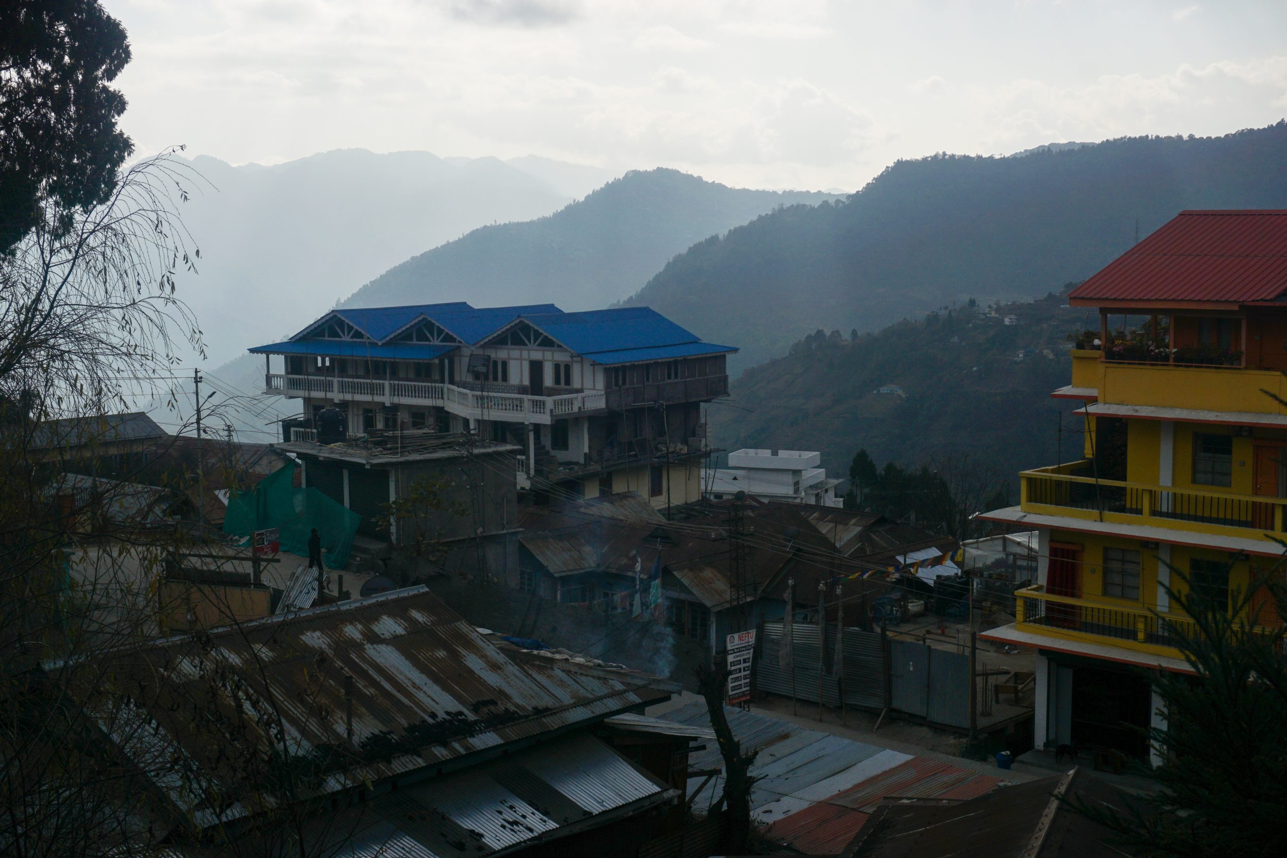 Buildings with colourful roofs in Bomdila Market. The shops on the ground floor were closed on Saturday.