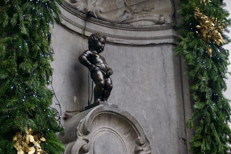 The pissing boy or Manneken Pis is a landmark figurine in Brussels. The imagery is used even in shops and souvenirs. I was expecting a large statue in the middle of a square—it was not so.