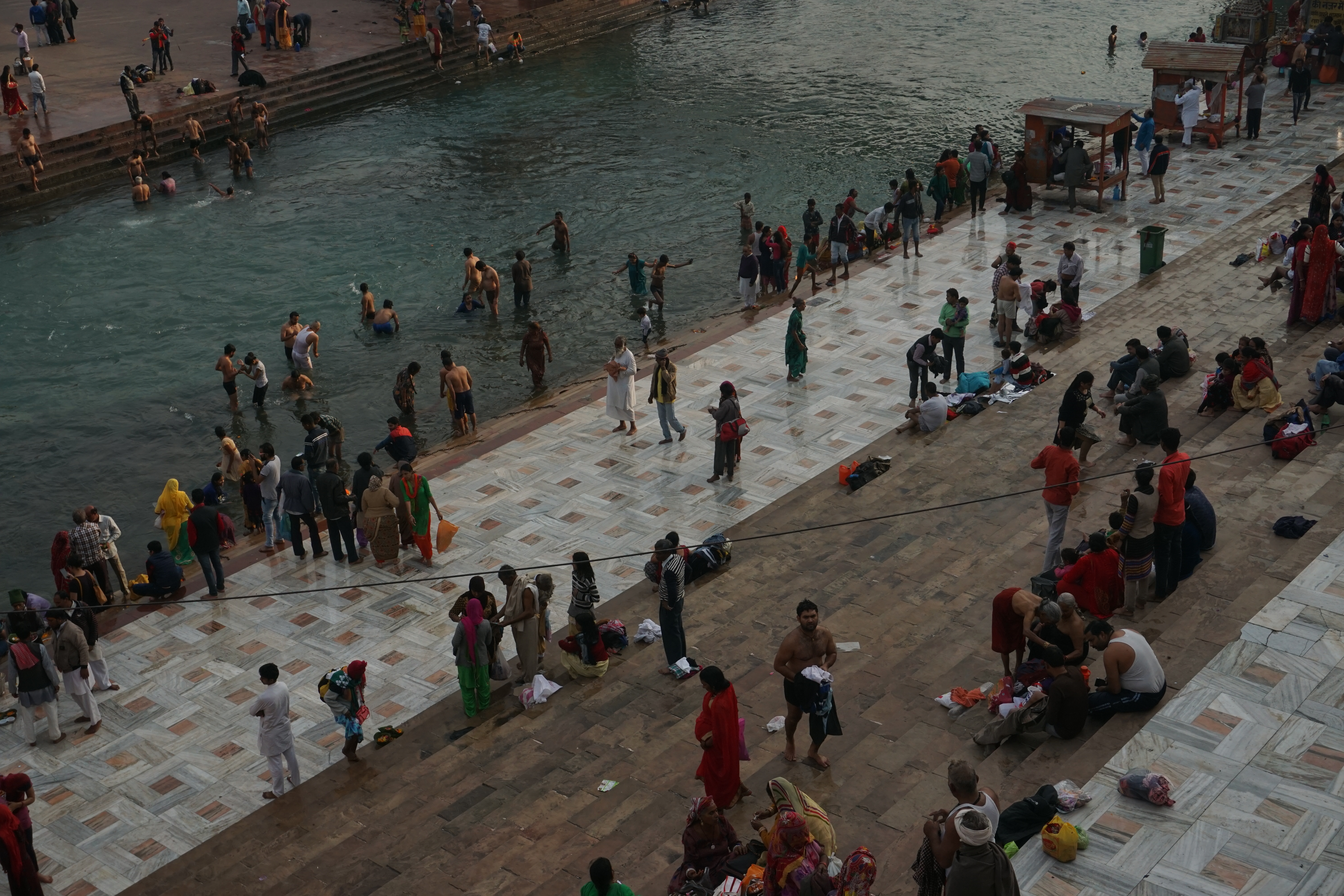 People taking a dip at the ghats.
