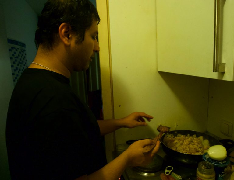 Partho cooking chicken for all of us.