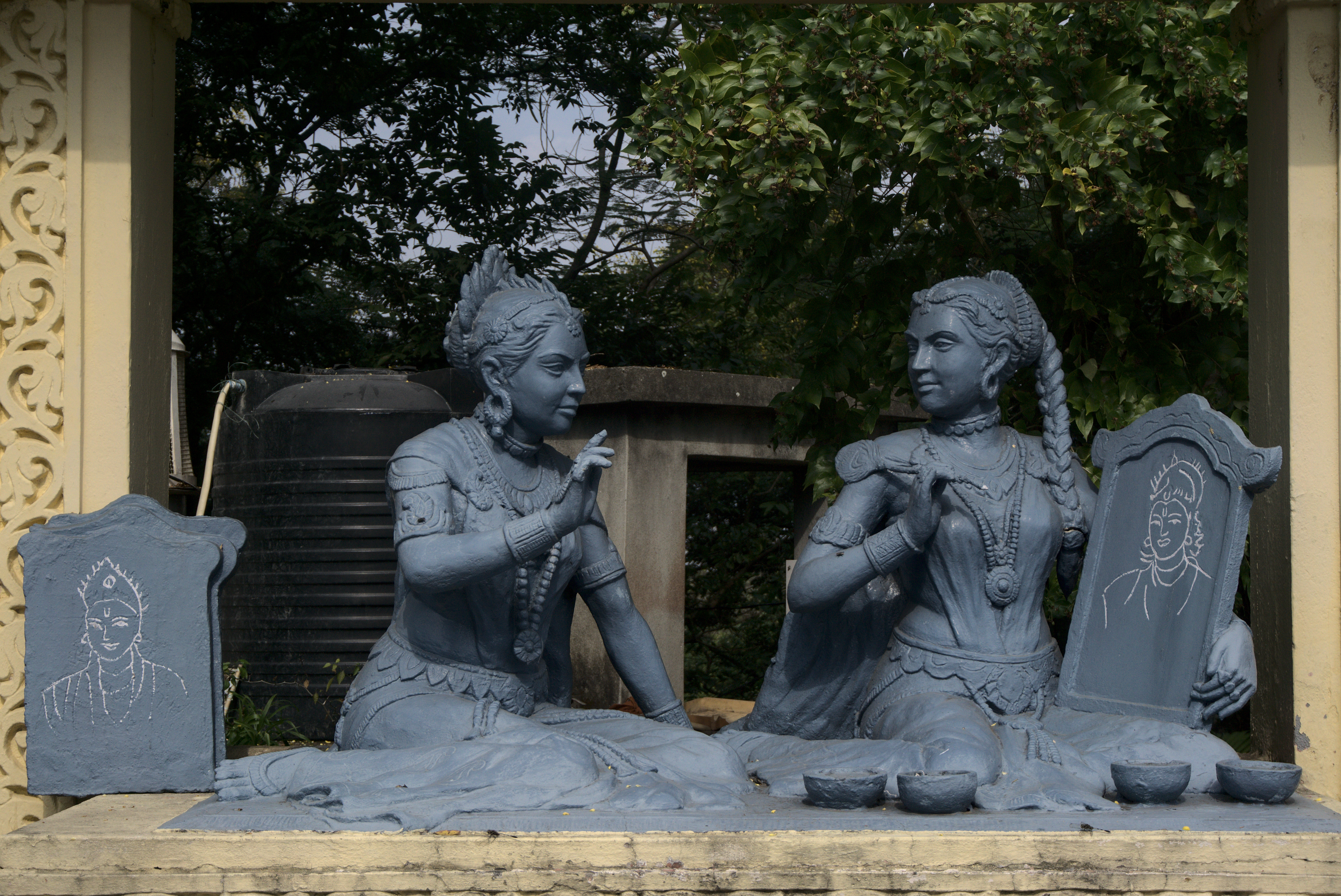 From the myth: Chitralekha trying to draw Anirudhha from Usha&rsquo;s description of him. I liked how the sculptor has depicted a stack of Chitralekha&rsquo;s failed attempts at drawing.