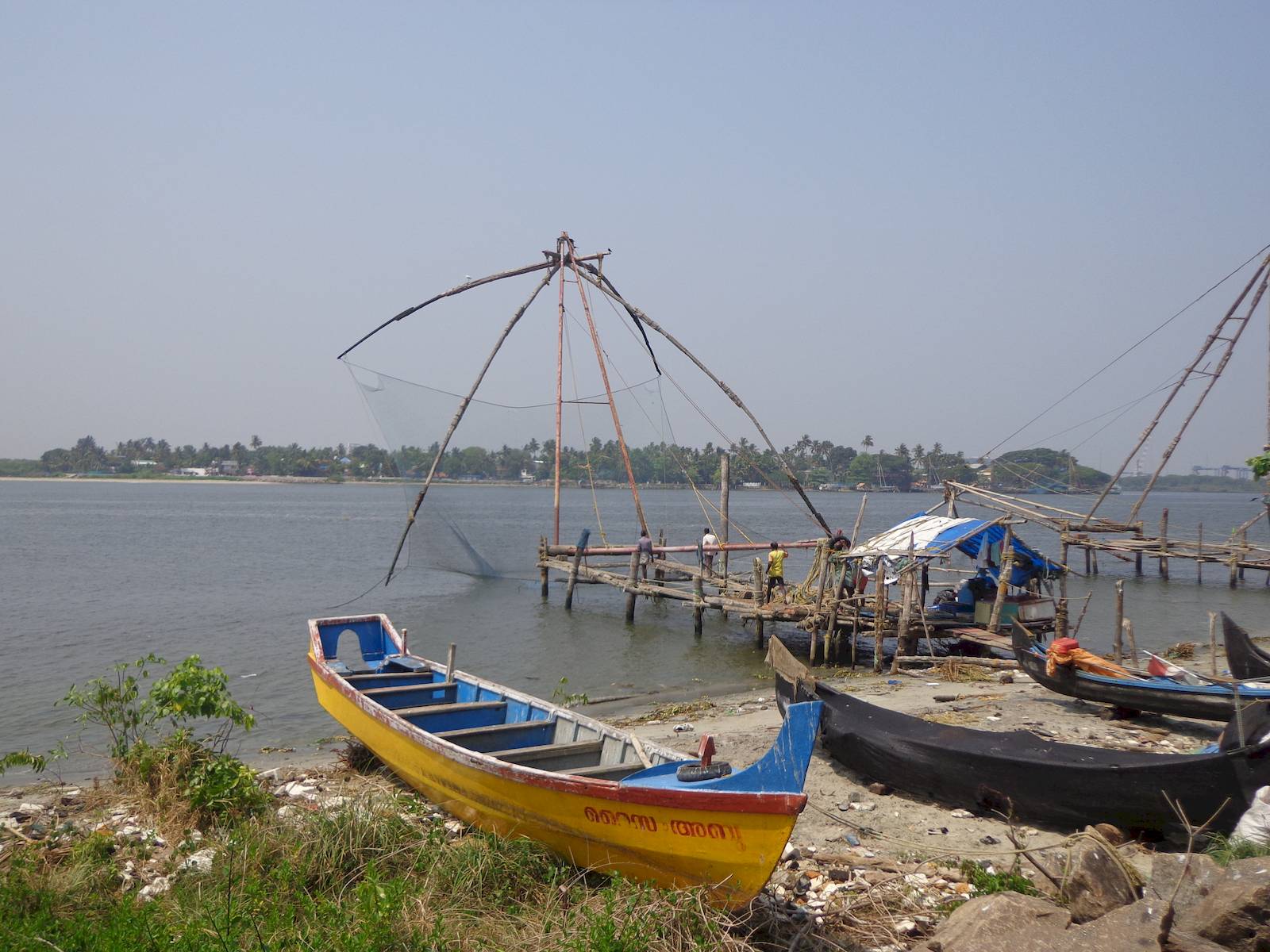 Fishermen operating a Cinese Fishing Net.