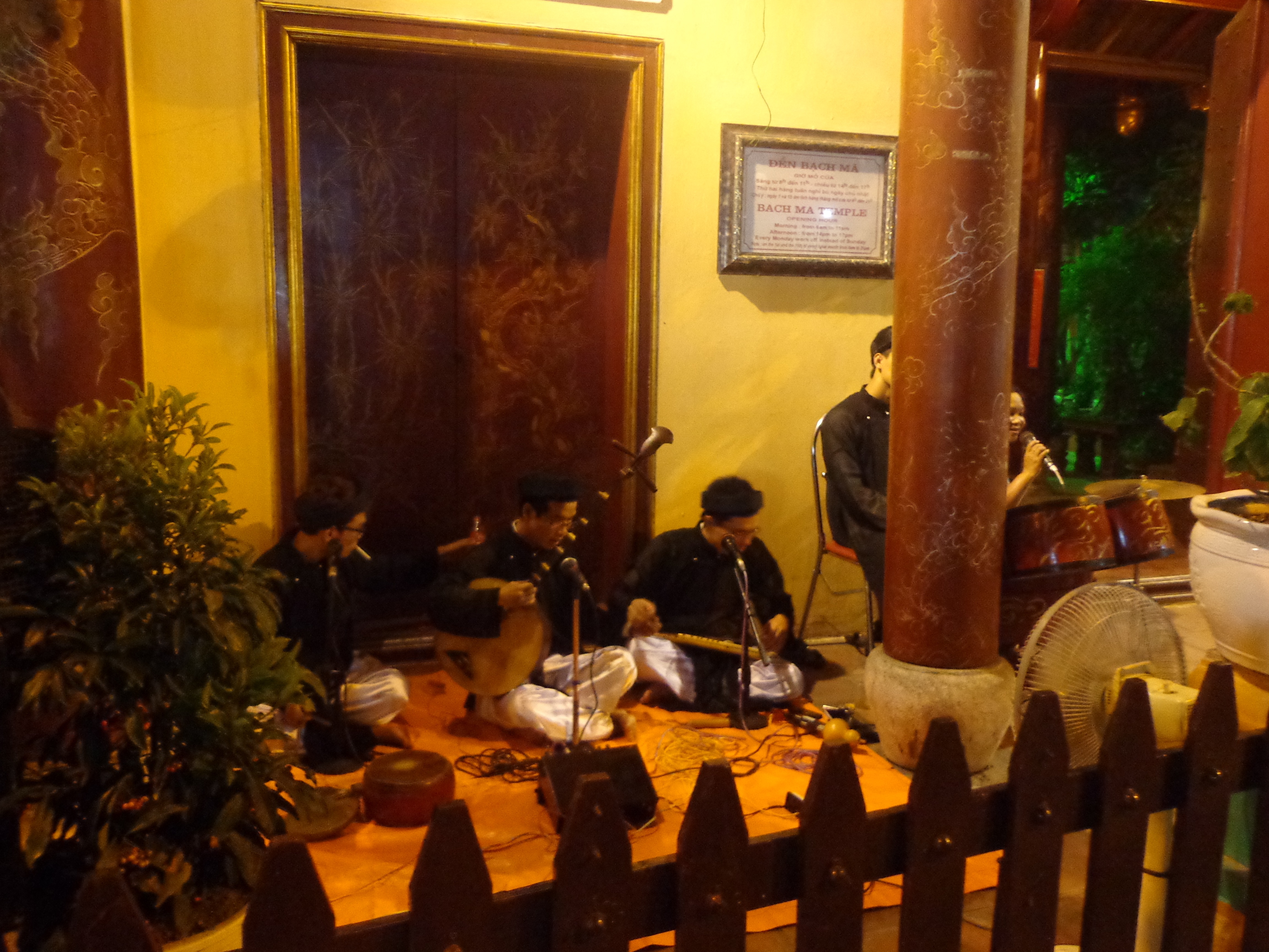 A group of traditional musicians playing in front of the White Horse Temple.