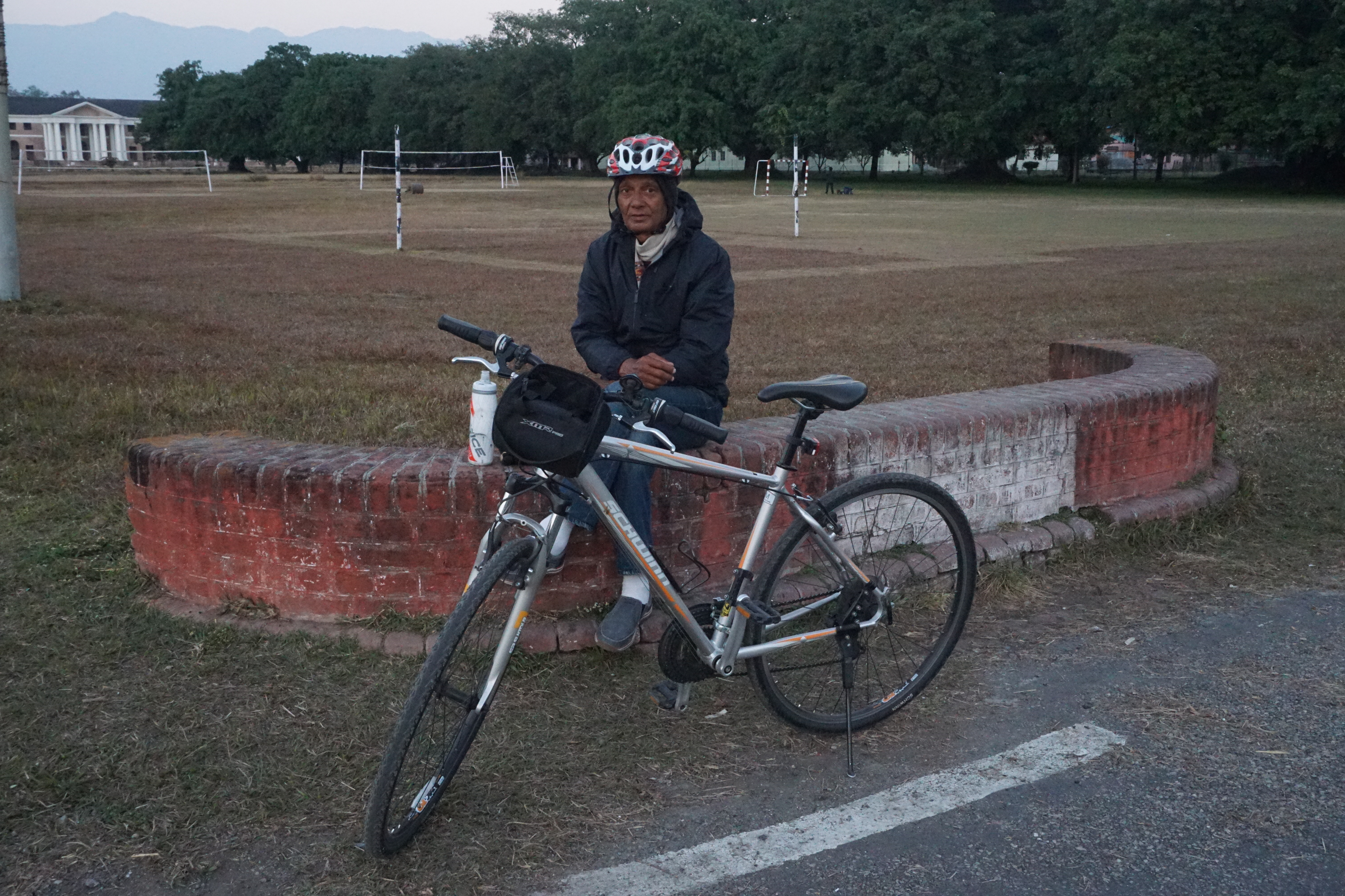 Mr. Bahuguna was sporty enough to wear his helmet before letting me click his photograph.