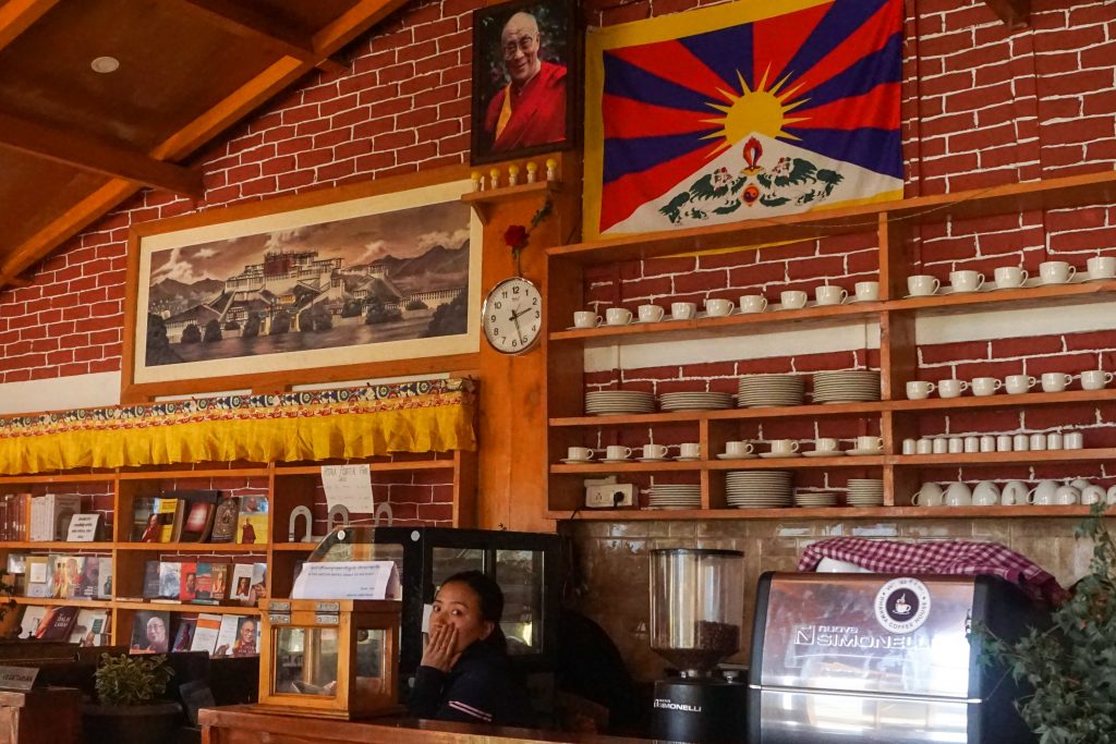 Dharma Cafe with its espresso machine, porcelain ware and its library.