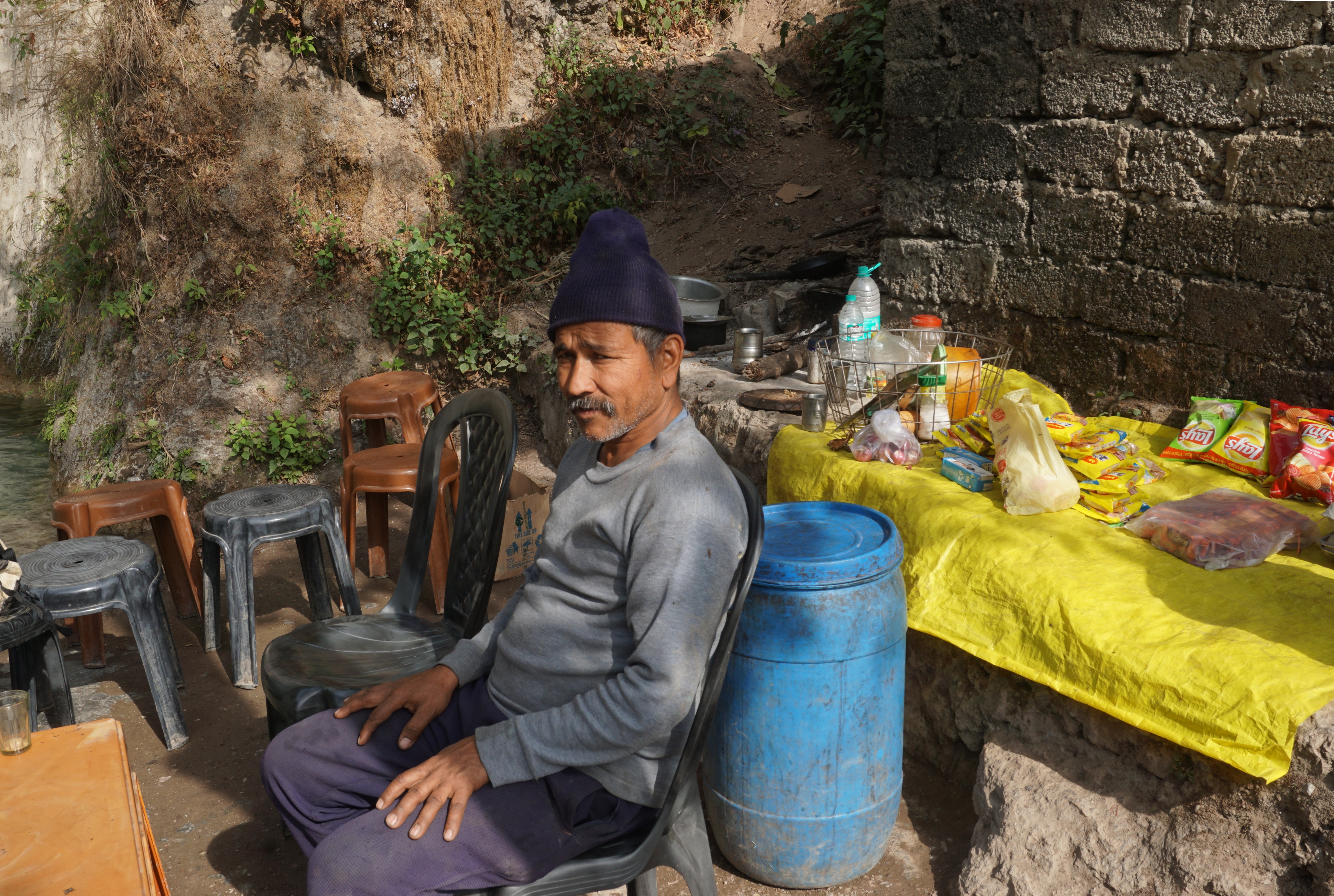 The lone shopkeeper at the top of the waterfall.