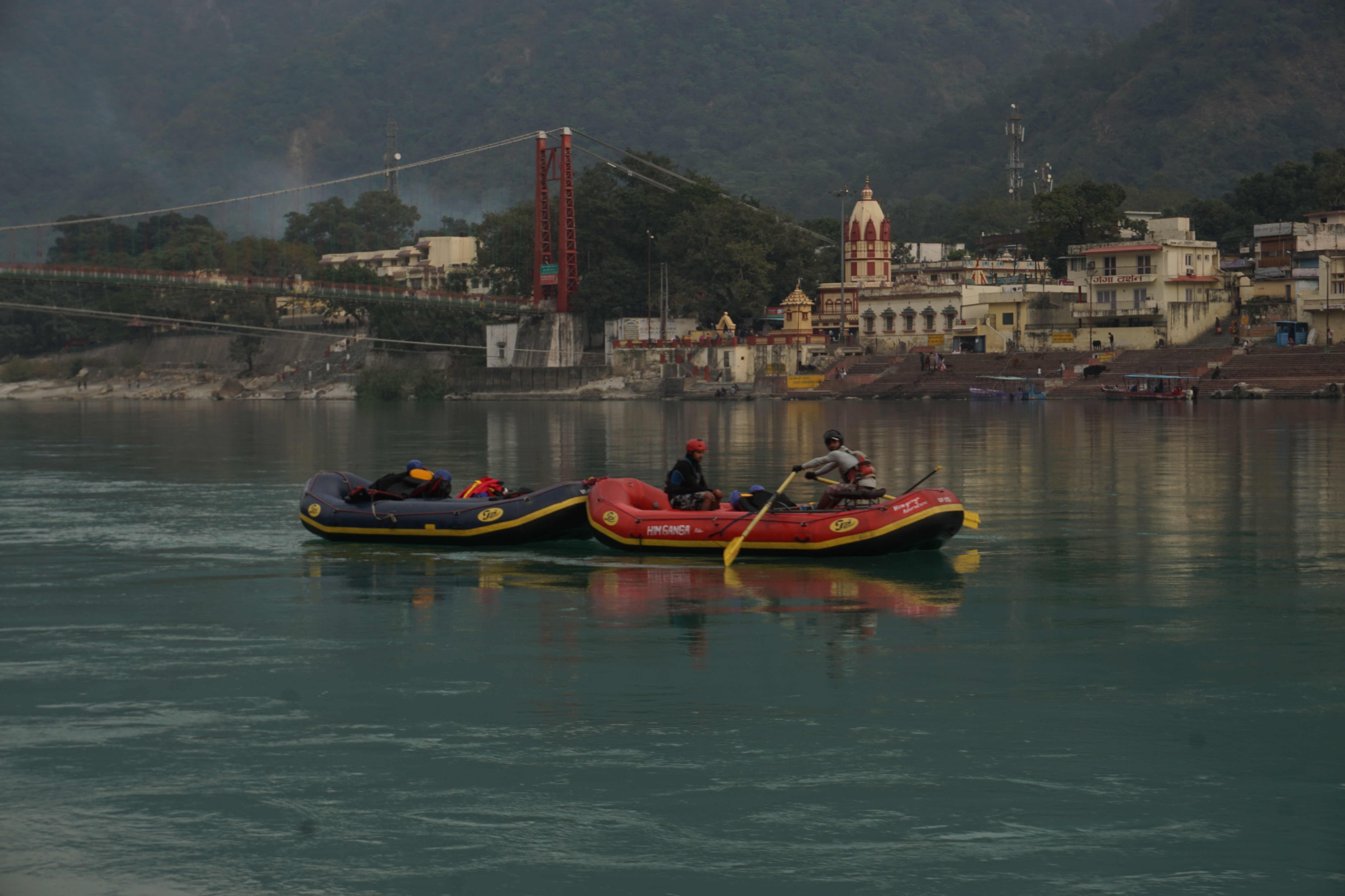 Rafting is a popular adventure sport in Rishikesh. The water was not turbulent enough to enjoy the thrill of white water rafting. It was more like kayaking on an inflatable boat.
