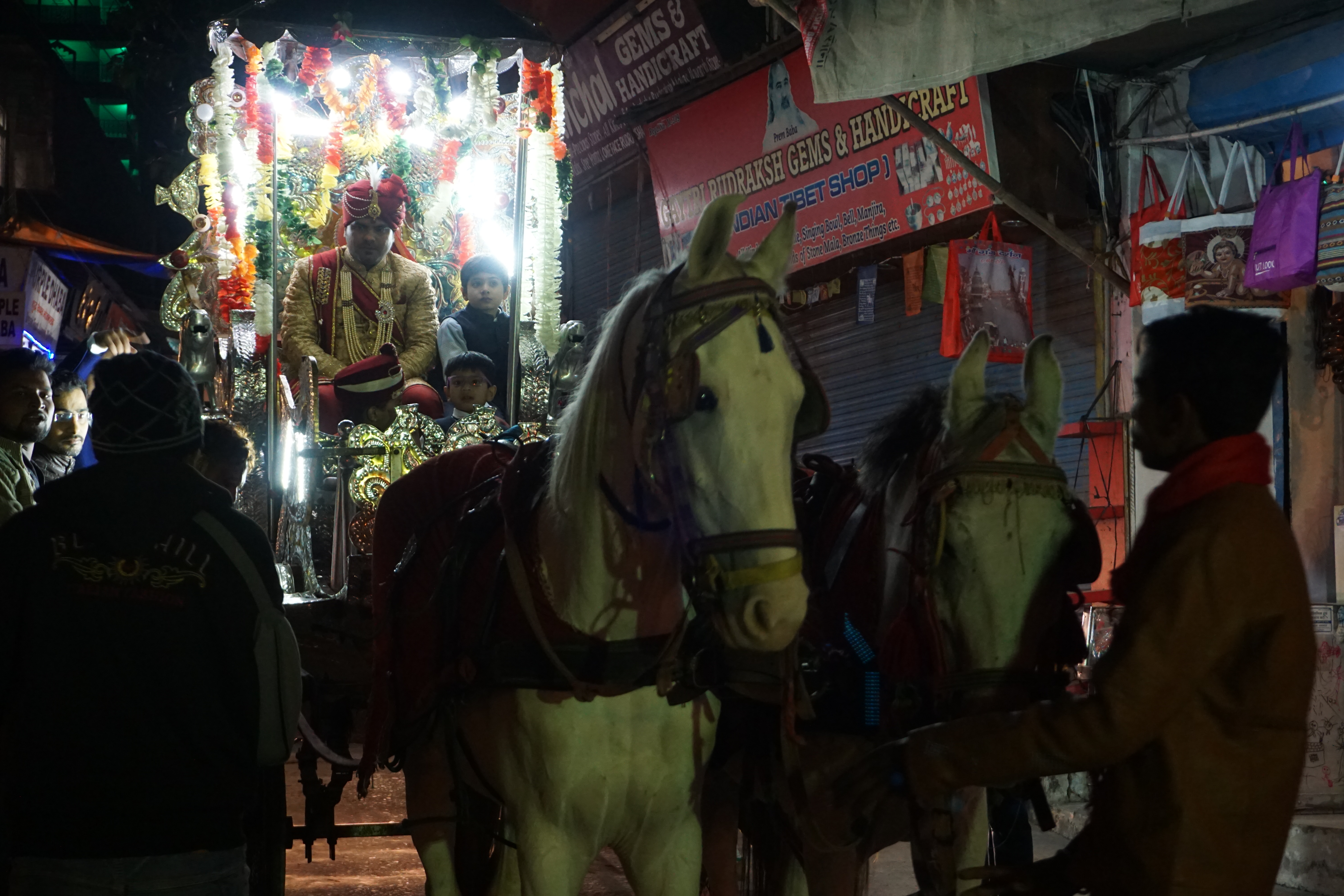 It was surely marriage season. A groom was being transported in a horse carriage. He was also escorted by an entire arsenal of dancing relatives, hired musicians and lighting guys much to the amusement of foreigners.
