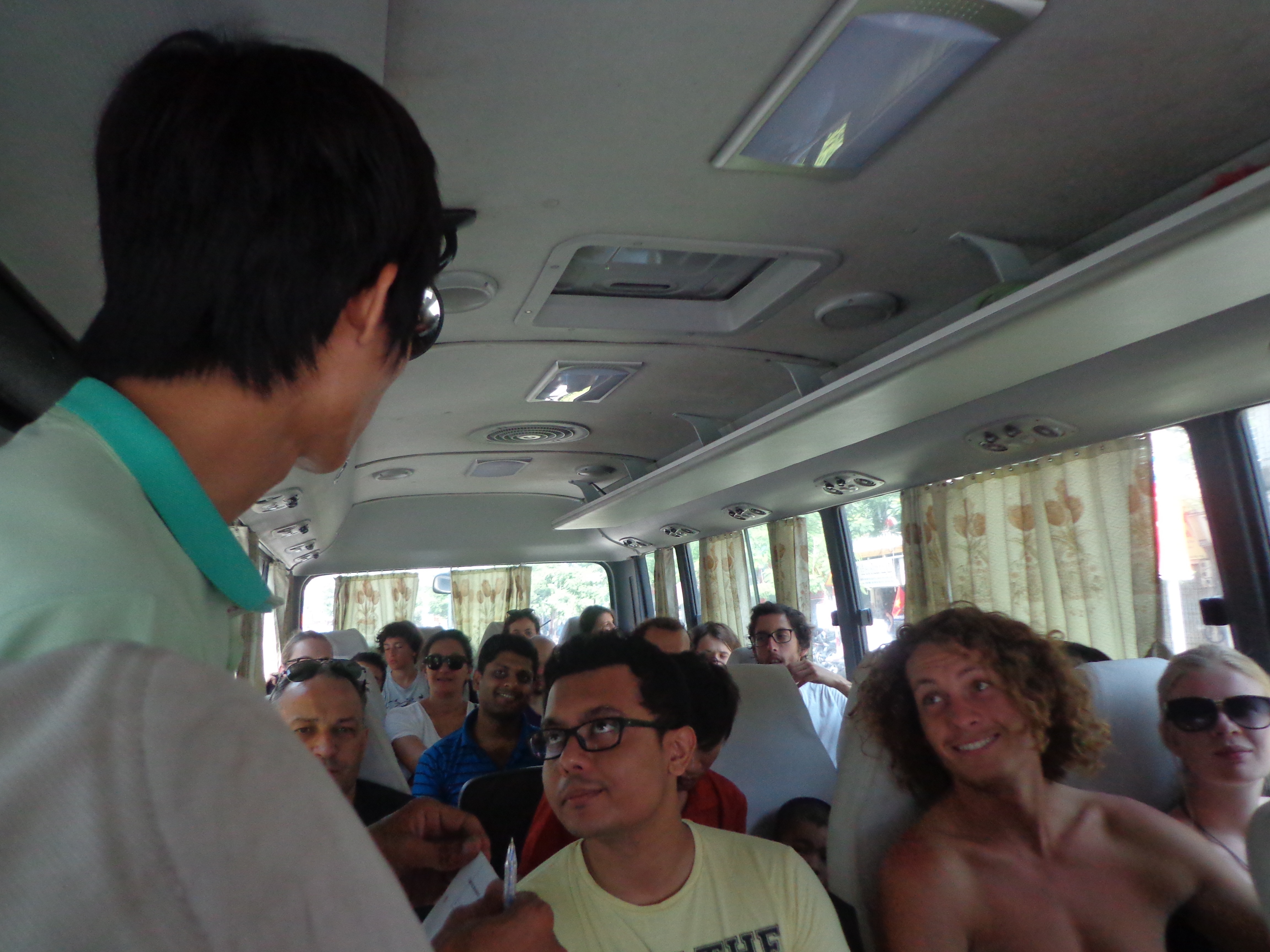 Phuong, our guide introduces himself and the trip itinerary on bus.