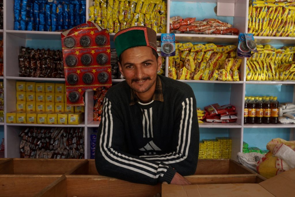 Yeshwant Singh, behind the counters of a shop in Rohgi village.