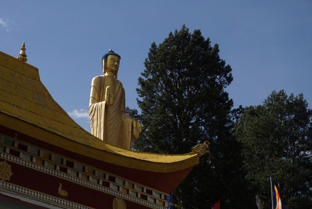 The standing Buddha statue at Kinnaur Mahabodhi society. It is visible from the National Highway below Reckong Peo.