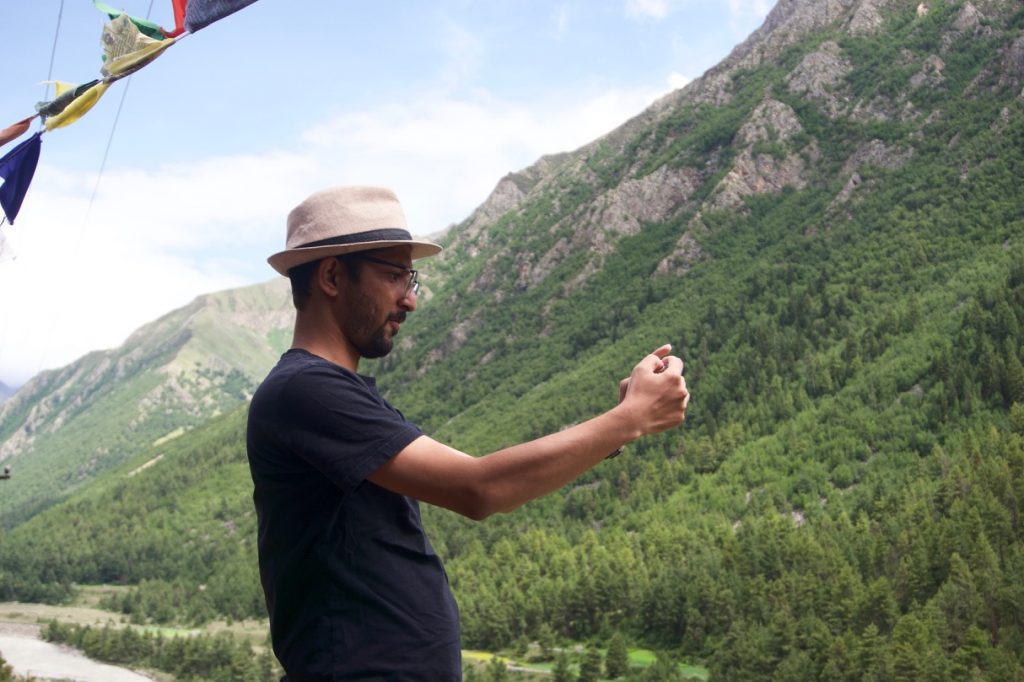 Kunal taking a photograph of the valley from the eatery.