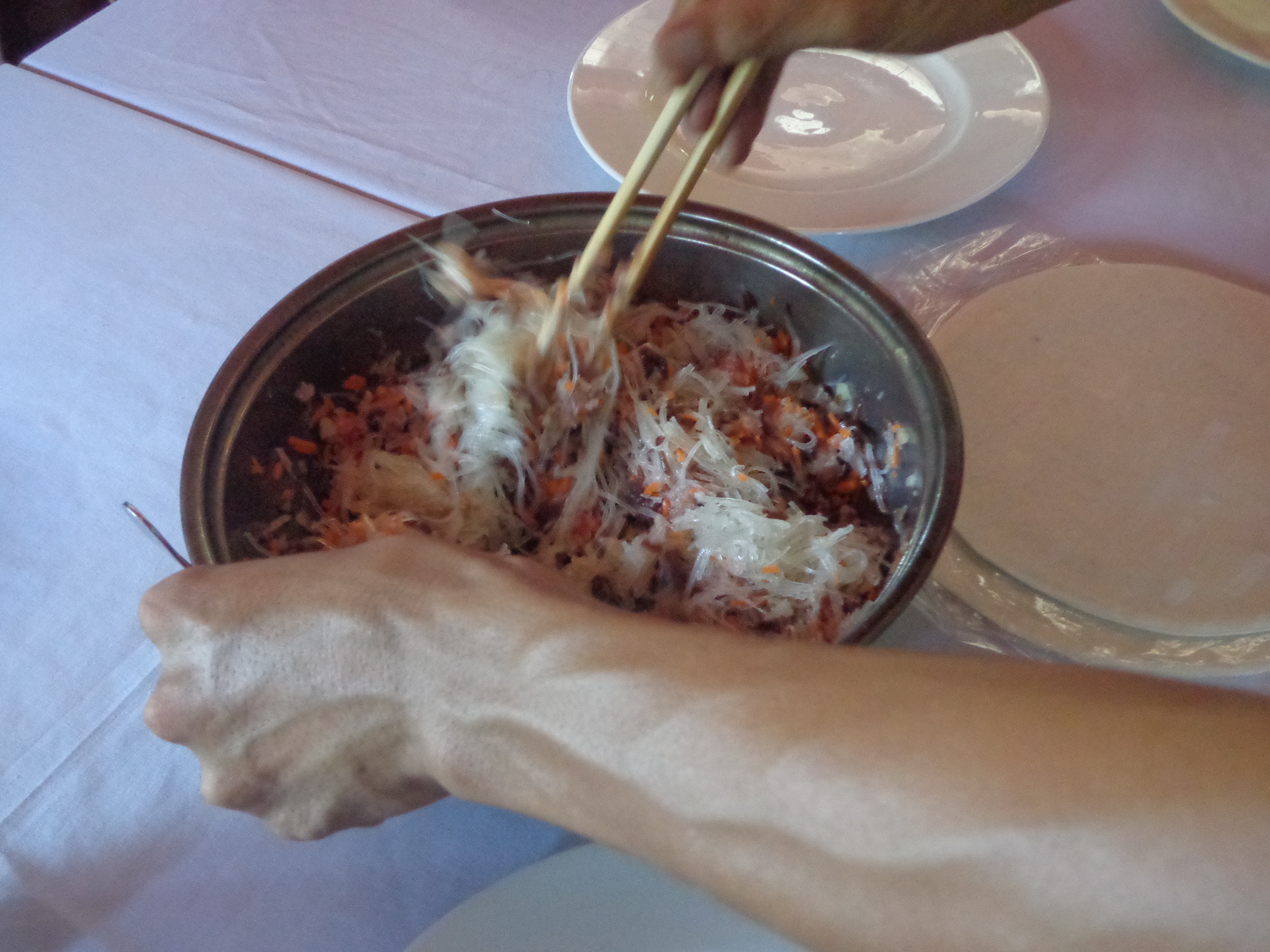 Phuong mixing the ingredients.