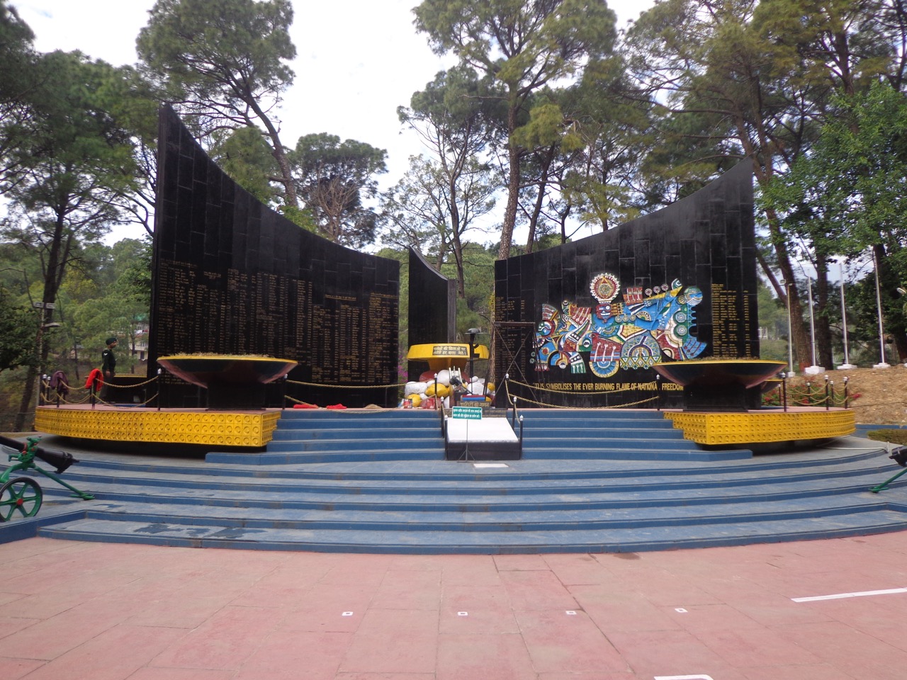 The names of the martyrs are written on the three black slabs.