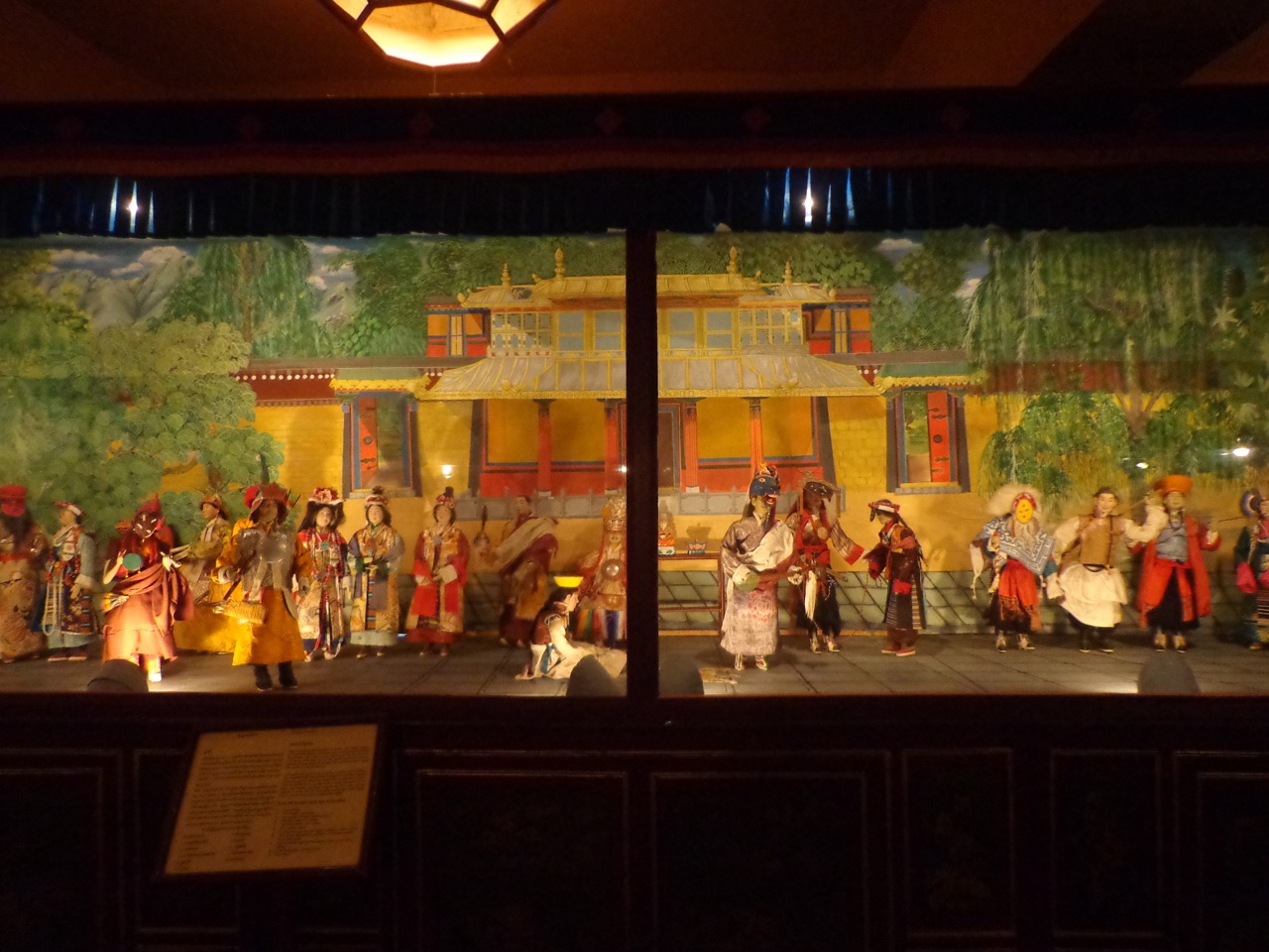 This is a scene from Lhamo Opera. Such operas were introduced by an 11th century saint, Tangton Gyalpo, in order to raise funds for building bridges. Later, the most elaborate of these became day long events.