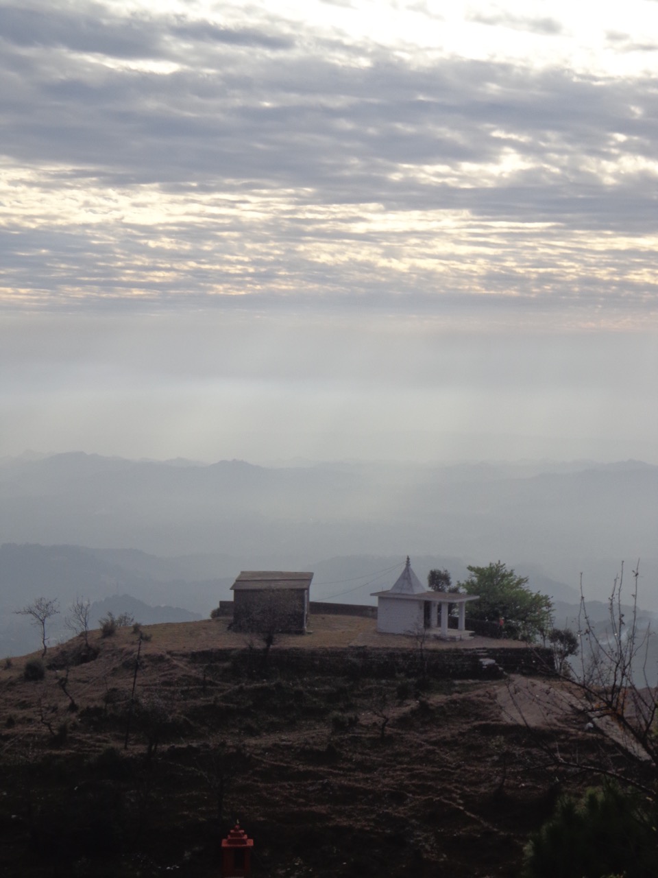 The old temple silhouetted against a cloudy sky.