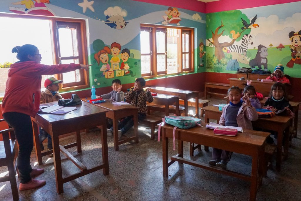 The teacher&rsquo;s kids in a classroom. The other classrooms were closed as no formal classes were being held during the pandemic.