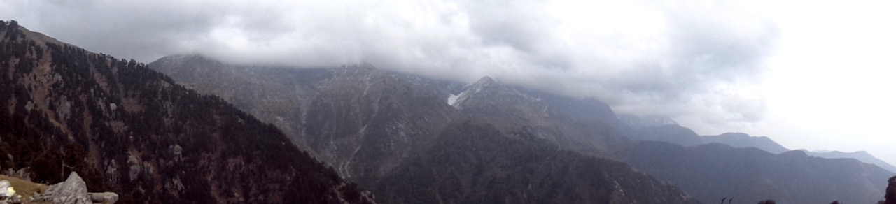 A panorama of the Dhauladhar range from Triund. Notice the clouds building up.