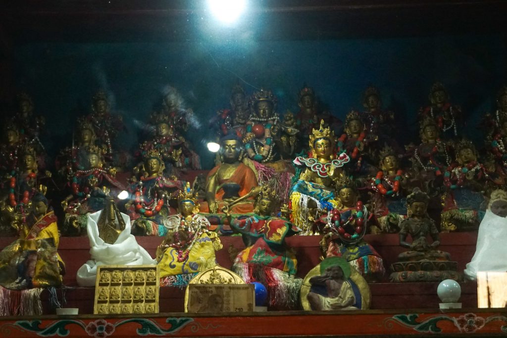 Idol of many Buddhas inside the prayer hall.