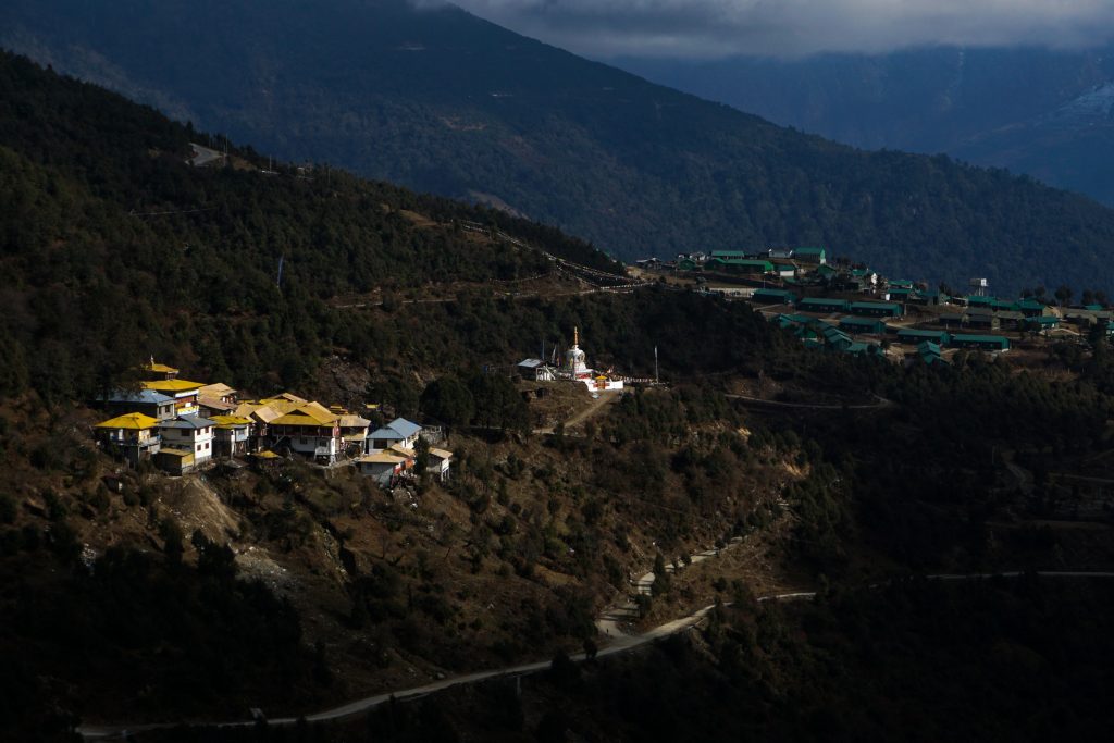 Bramadungchung Ani Gompa and a chorten. To the right is an army barrack with their trademark green roofs.