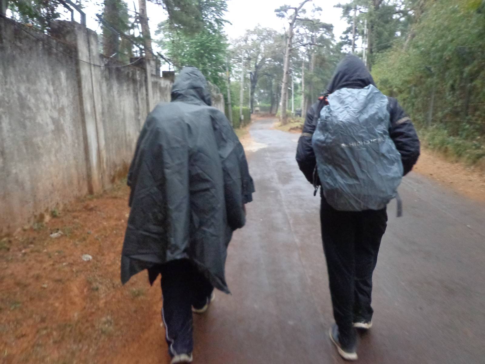 Nandy and Gowri Sankar with their rainwears on.