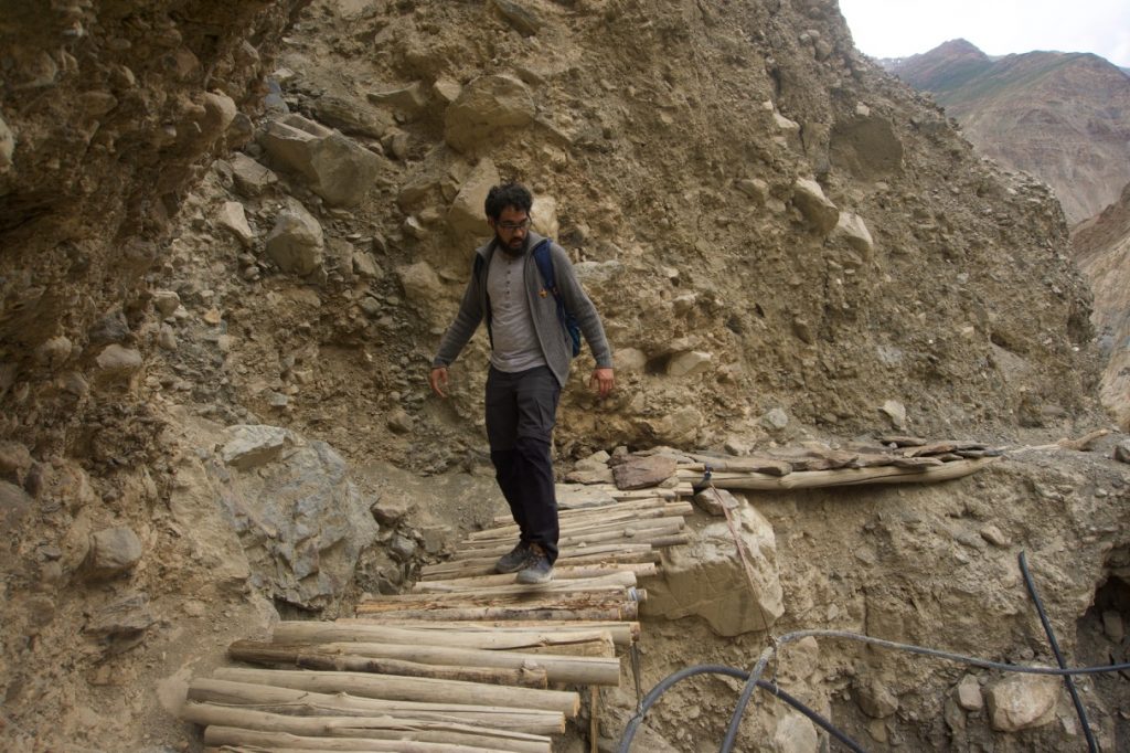 Some gnarly stretches have been made walkable by the villagers. Here&rsquo;s Sai trying to cross a bridge.