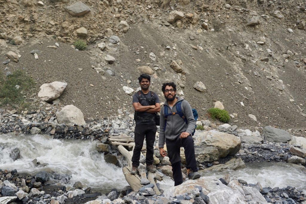 Posing over a log bridge that one has to cross to get to the other mountain where the monastery is situated. Melting snow washes off these temporary bridges every year and a new one has to be made.