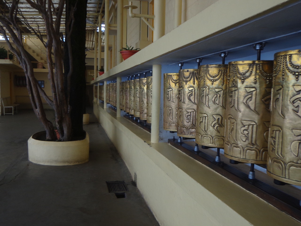 The Mani prayer wheels that surround the temple. Visitors are asked to move in clockwise direction.