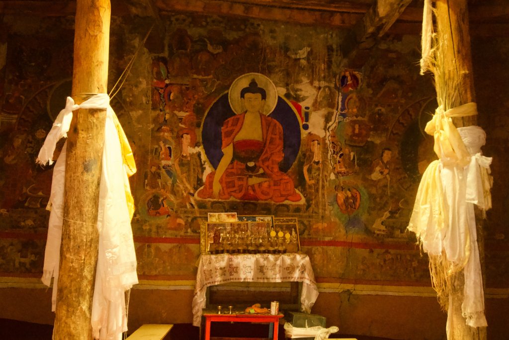 Mural of Buddha on the walls of the upper chamber.