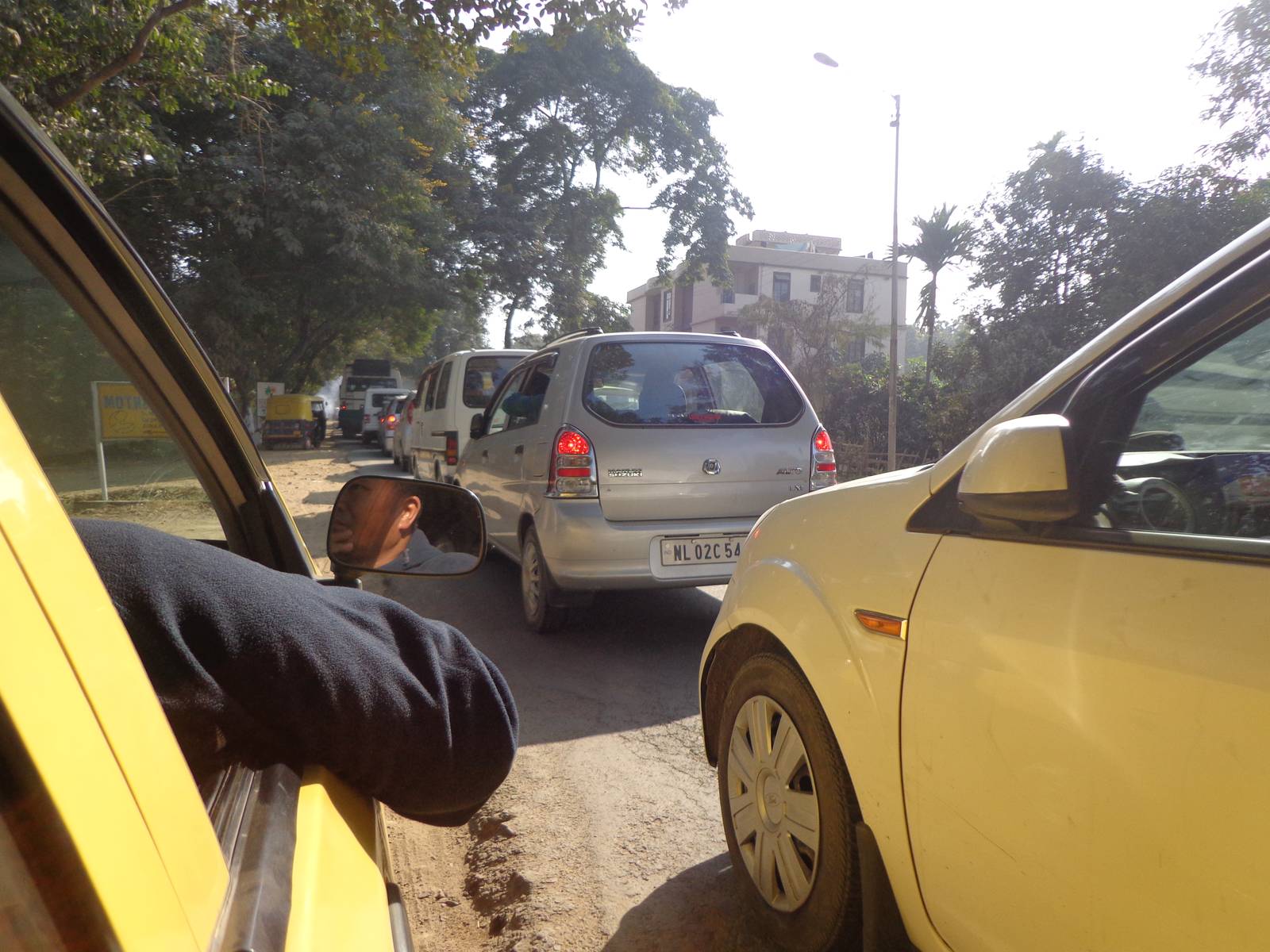 A bumper to bumper jab in Dimapur. Our taxi driver had already pulled the cab into the dirt pavement.