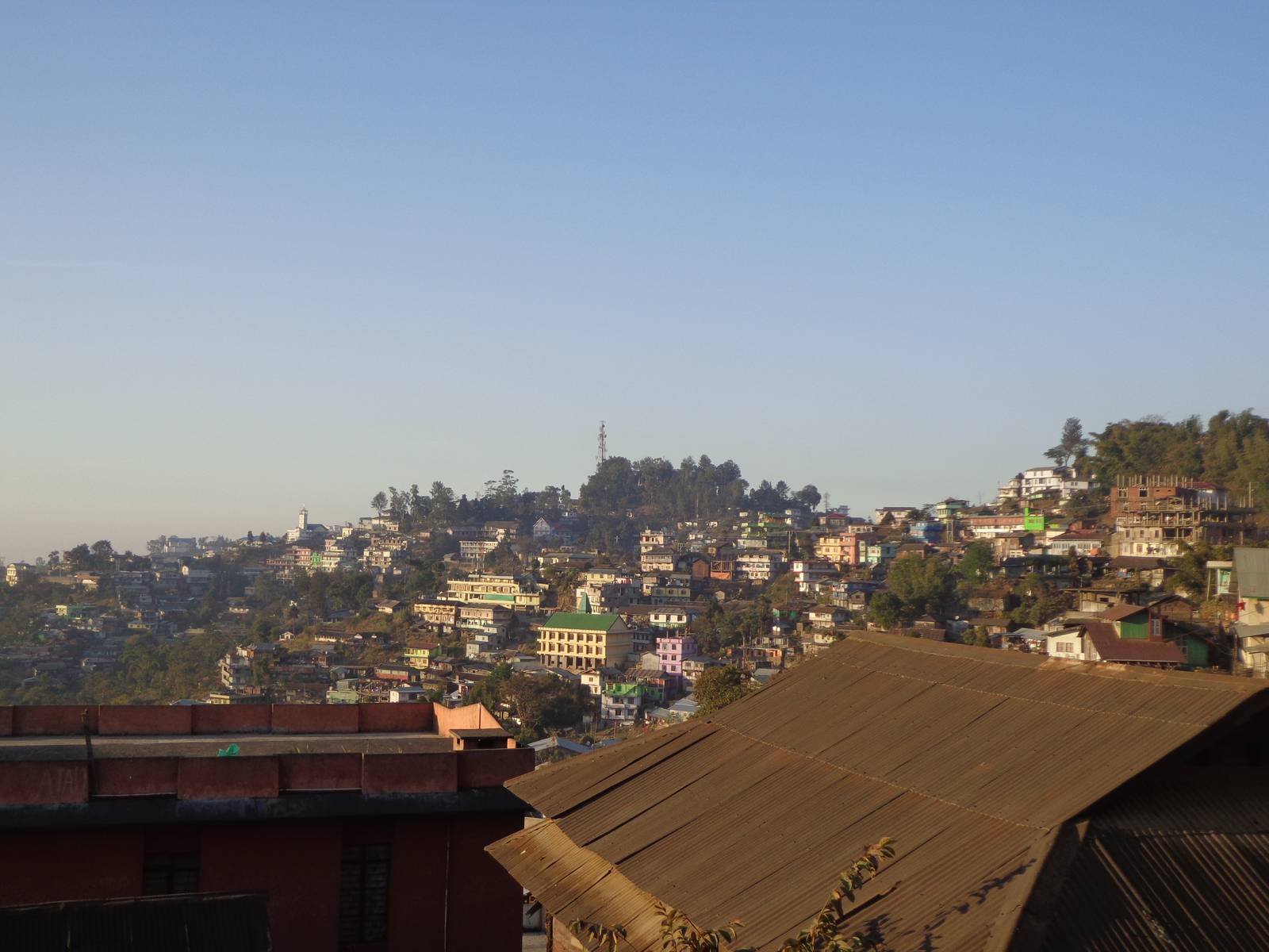 I have a cheap point and shoot. This shot of Kohima from a moving vehicle doesn&rsquo;t do justice.