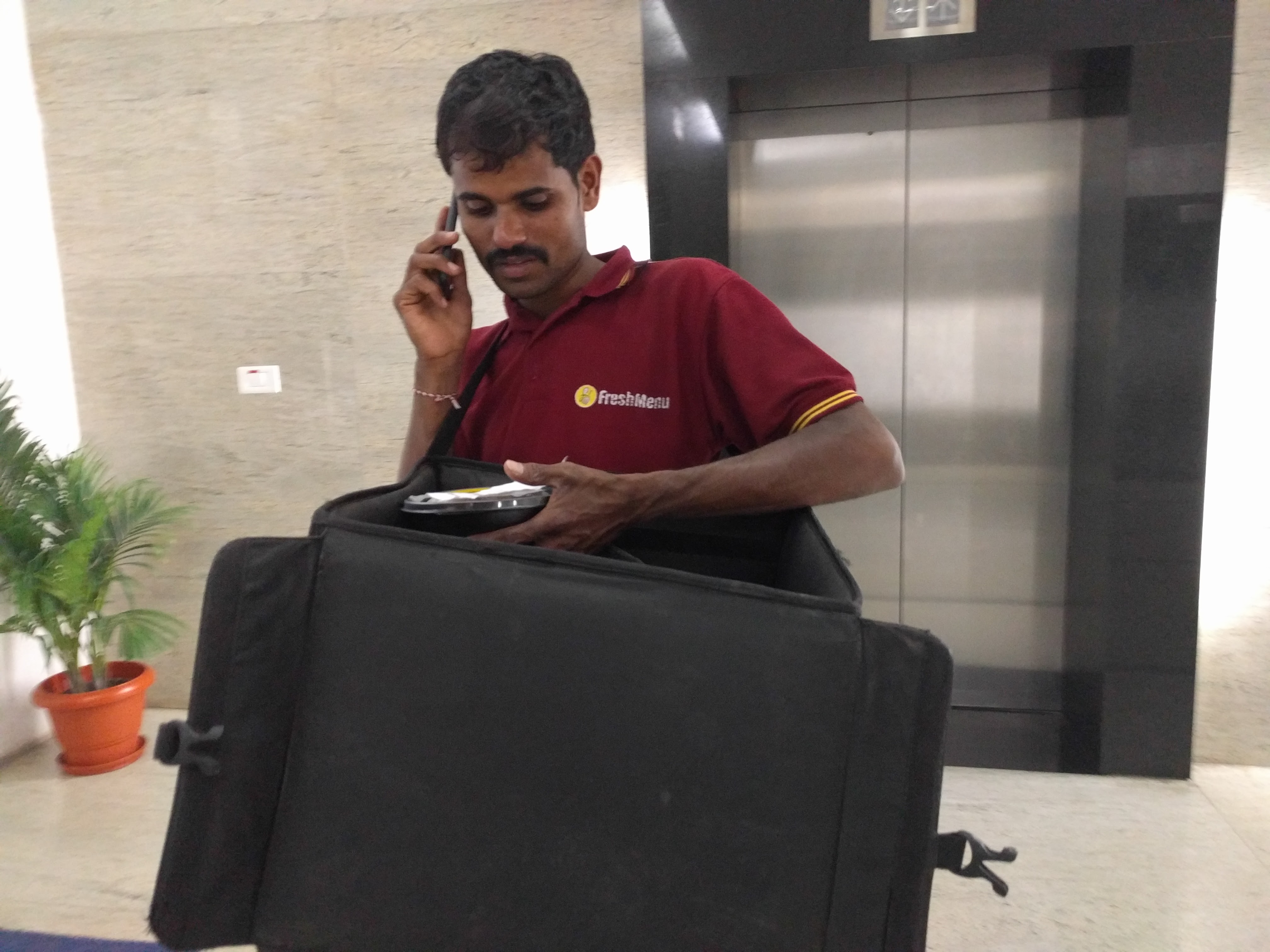 The second delivery guy making a call to their kitchen and explaining the goof up.
