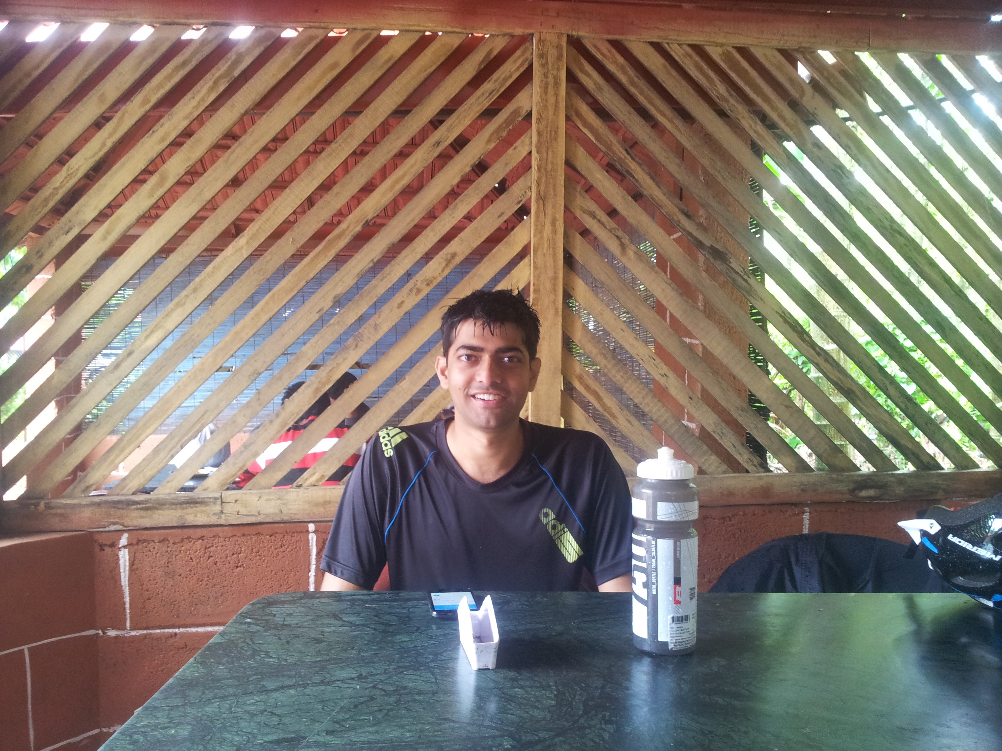 Ravish waiting for the meal. We shared a plate of tomato rice, dal and chicken curry.