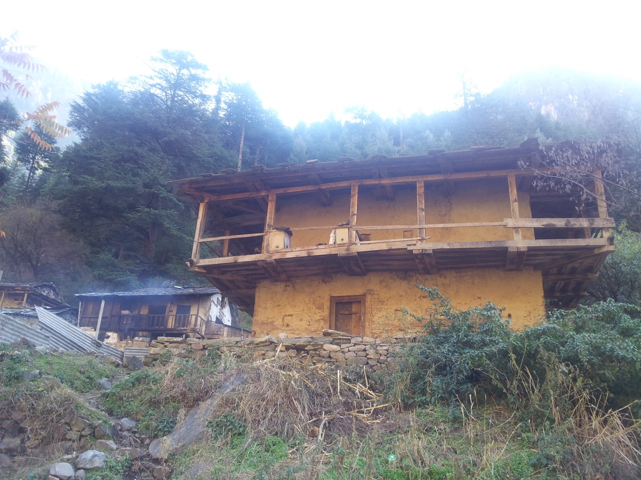 Two-storey building made of wood and clay. I have seen similar buildings in southern West Bengal’s villages.