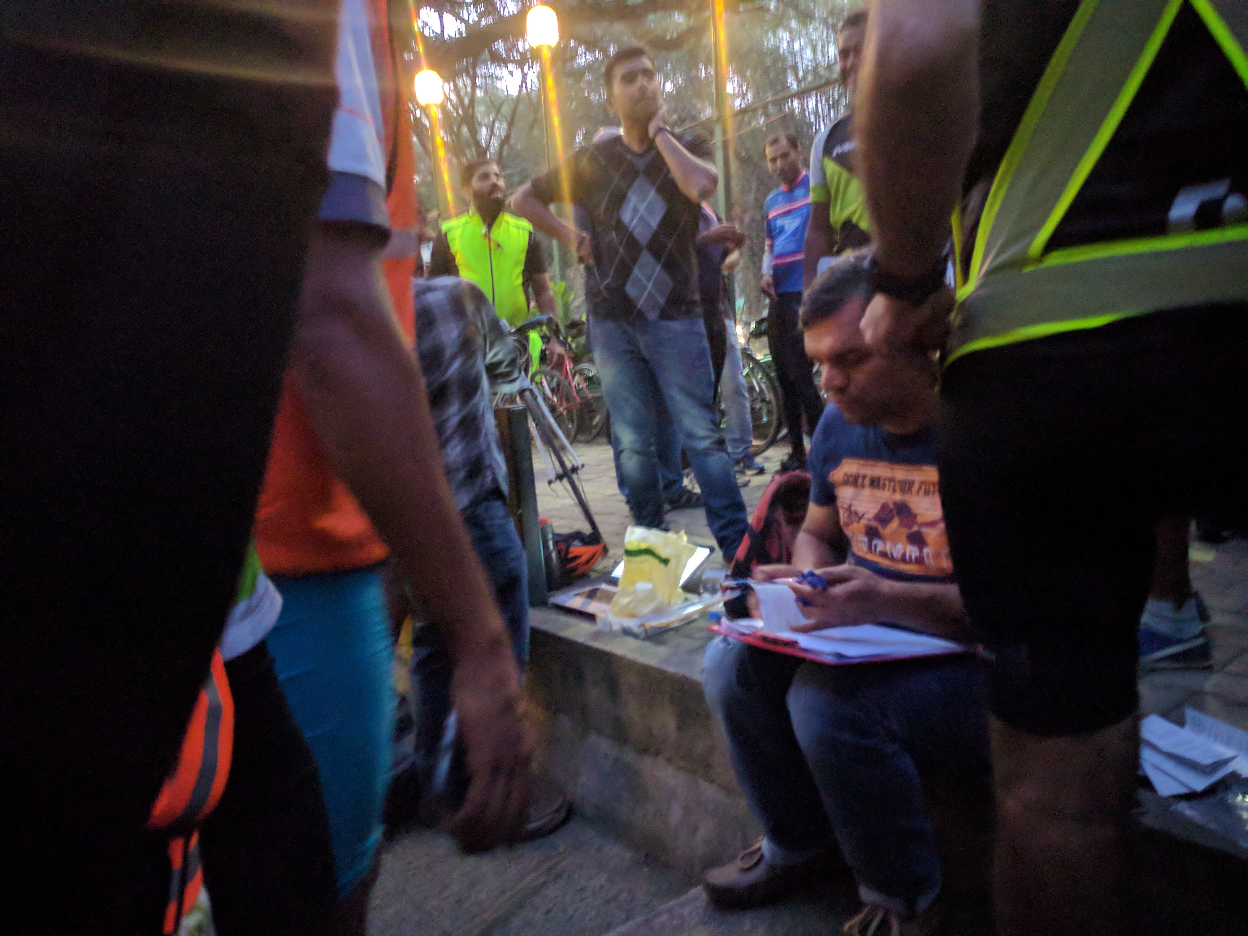 Alok signing the cards for the riders and putting on the final times.