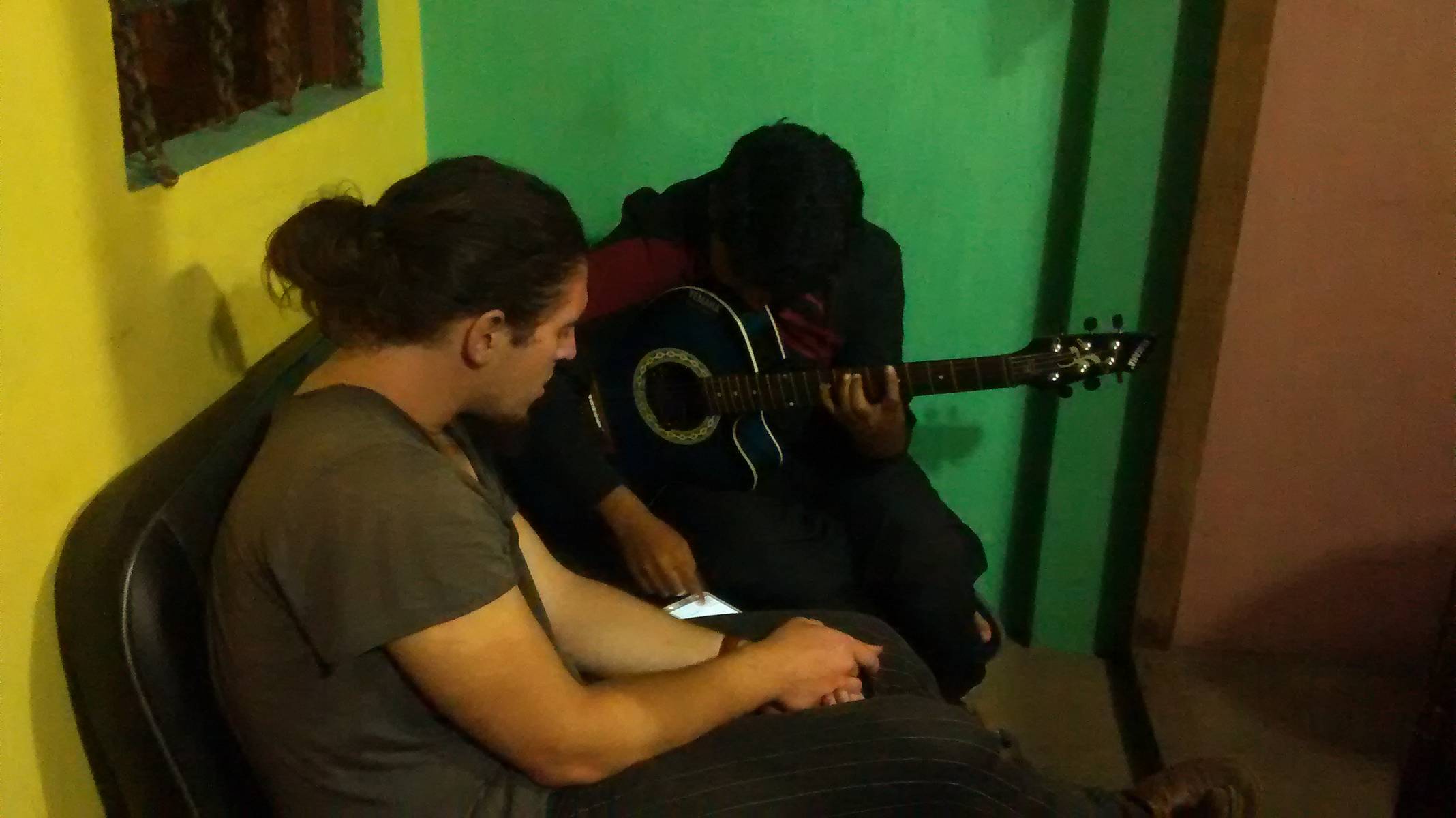 Greg came by when he heard me playing the guitar. It wasn’t my playing but the existence of a musical instrument that attracted him there. Image courtesy: Gowri Sankar.
