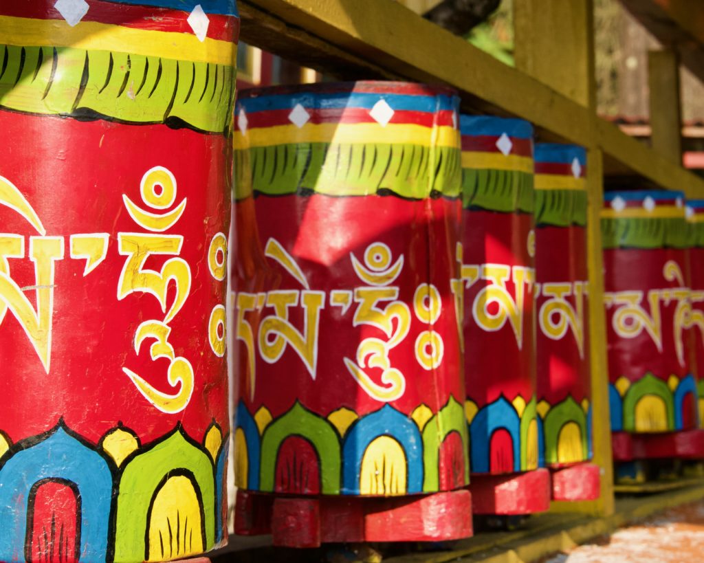 Colourful prayer wheels at Tshoka monastery.