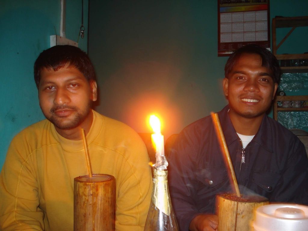 Prabir and Bhanu trying out tongba. I remember that none of us liked it.