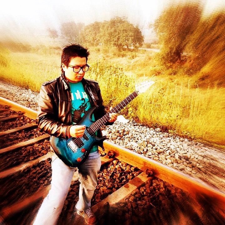This is Ugyal during the video shoot three years ago. The railway track he is standing on is close to the Sarjapur railway junction. I am sure that the barren background is no more barren. P.S. We did not use any footage from this Sarjapur session.